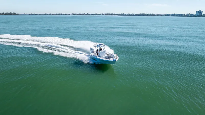 Slide: The Image of 2022 Barker Boatworks 26 Open cruising on open water, creating a wake. - 33