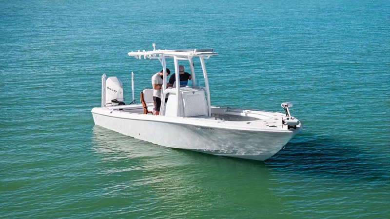Slide: The Image of 2022 Barker Boatworks 26 Open on clear blue water, showcasing sleek design and modern features. - 5