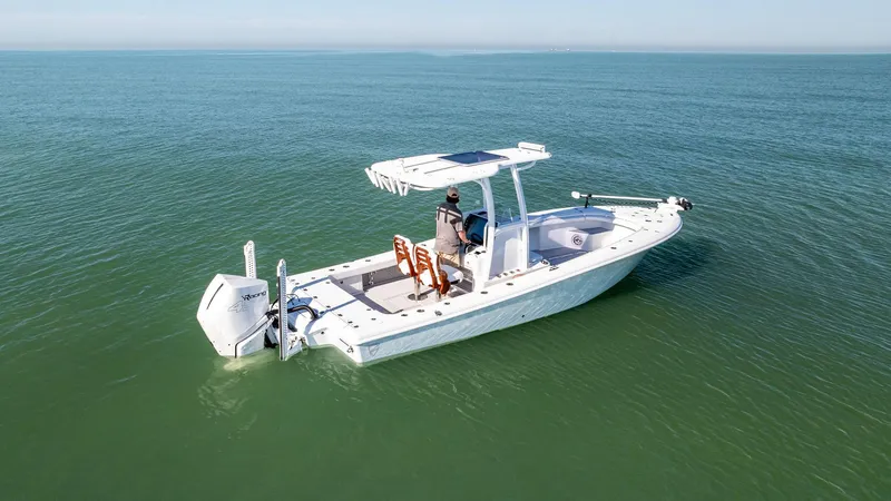 Slide: The Image of 2022 Barker Boatworks 26 Open on calm sea, featuring sleek design and modern equipment. - 6