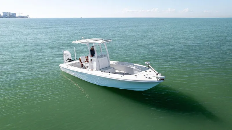 Slide: The Image of 2022 Barker Boatworks 26 Open on calm sea, showcasing sleek design and modern features. - 7