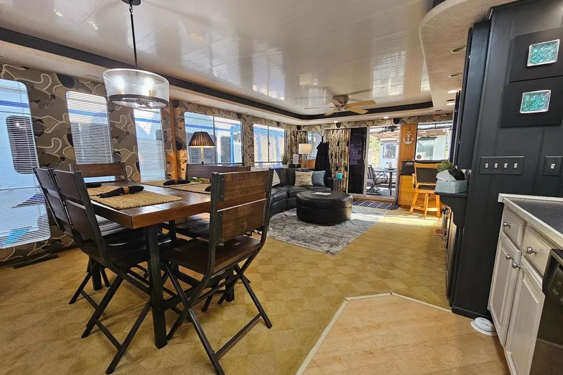 Slide: The Image of Luxurious 2000 Sumerset 16x75 houseboat interior with modern dining and living area. - 11
