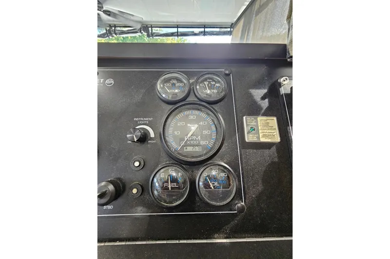 Slide: The Image of Instrument panel of a 2000 Sumerset 16x75 houseboat with gauges and controls. - 17