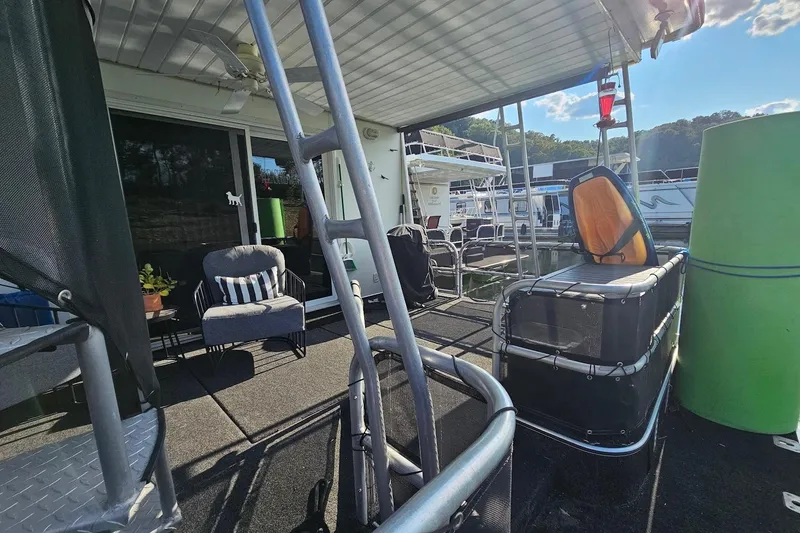 Slide: The Image of Houseboat deck with seating, ladder, and scenic view; Sumerset 16x75, year 2000. - 54