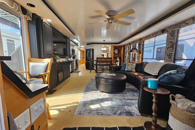 Slide: The Image of Luxurious interior of a 2000 Sumerset 16x75 houseboat with modern furnishings and decor. - 6