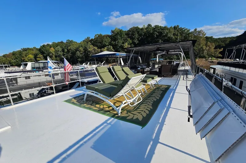 Slide: The Image of Rooftop deck of 2000 Sumerset 16x75 houseboat with lounge chairs and scenic marina view. - 64