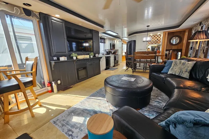 Slide: The Image of Luxurious interior of a 2000 Sumerset 16x75 houseboat with modern furnishings and cozy decor. - 7