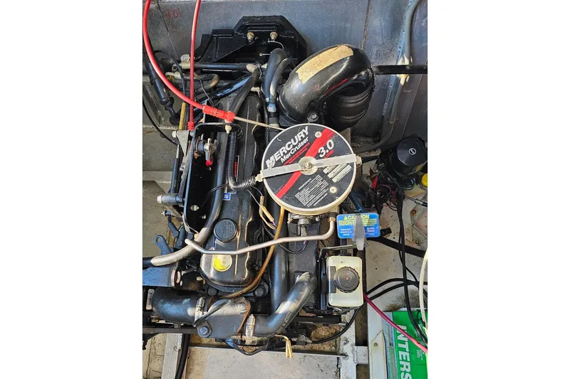 Slide: The Image of Engine of a 2000 Sumerset 16x75 houseboat with MerCruiser 3.0 liter motor. - 74