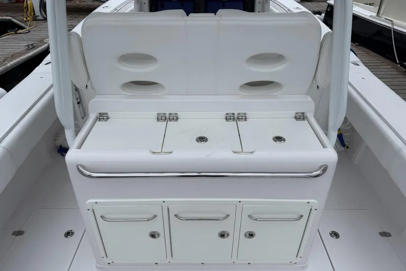 Slide: The Image of 2018 Southport 33 FE boat interior with storage compartments and seating. - 11