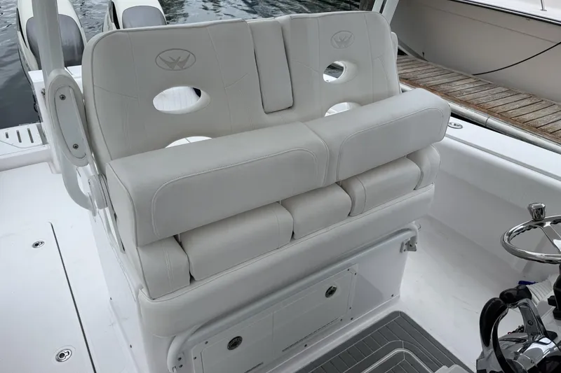 Slide: The Image of Luxurious seating on 2018 Southport 33 FE boat, featuring plush white upholstery. - 13