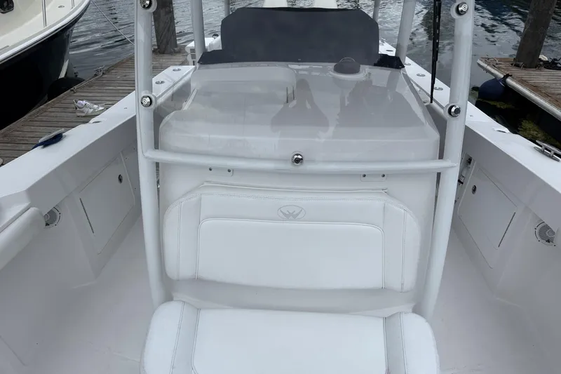 Slide: The Image of 2018 Southport 33 FE boat interior with white seating and console. - 19
