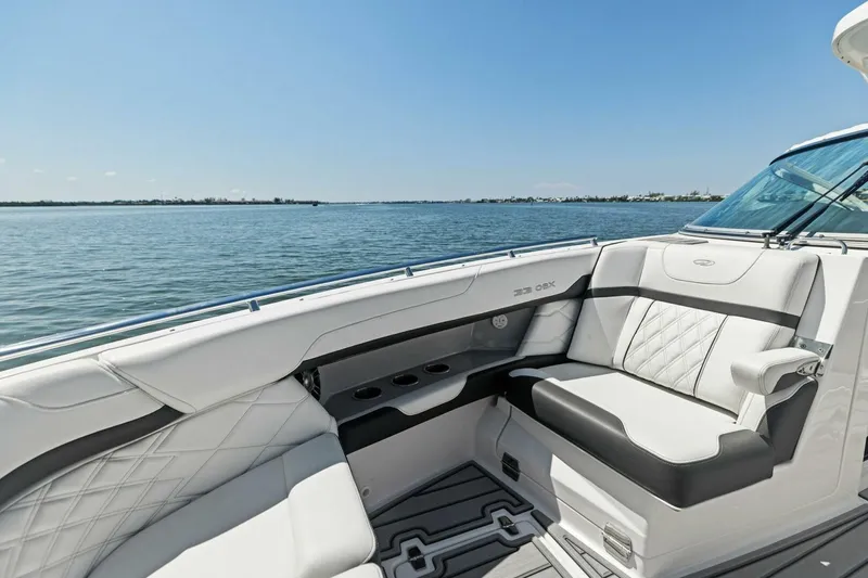 Slide: The Image of Luxurious 2022 Regal 33 OBX boat interior with elegant seating on a sunny day. - 12