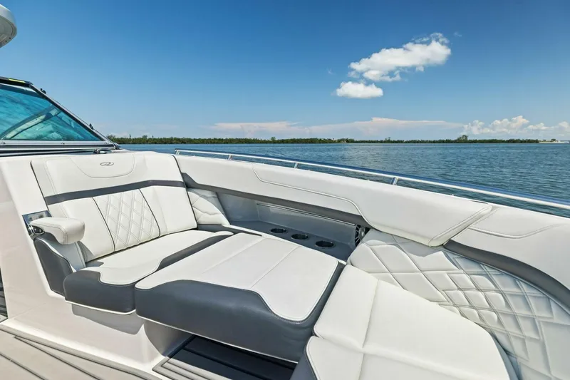 Slide: The Image of Luxurious seating on 2022 Regal 33 OBX boat with scenic water view. - 13