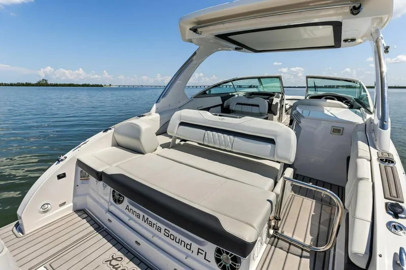 Slide: The Image of 2022 Regal 33 OBX boat with luxurious seating on calm waters, Anna Maria Sound. - 38