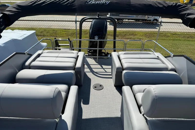 Slide: The Image of 2025 Bentley Pontoons Legacy 243 QSB with luxurious seating and sleek design. - 11