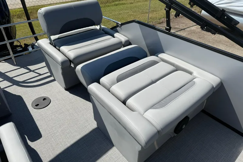Slide: The Image of 2025 Bentley Pontoons Legacy 243 QSB interior with luxurious gray seating and modern design. - 14