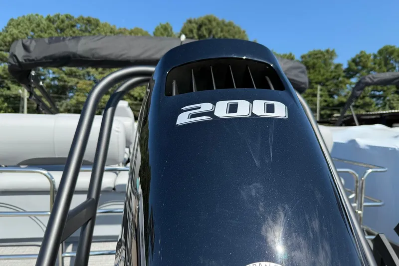 Slide: The Image of 2025 Bentley Pontoons Legacy 243 QSB with 200 horsepower engine, close-up view. - 18