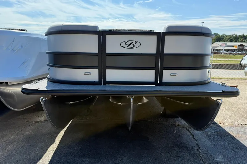 Slide: The Image of 2025 Bentley Pontoons Legacy 243 QSB, sleek design, front view, outdoor display. - 2
