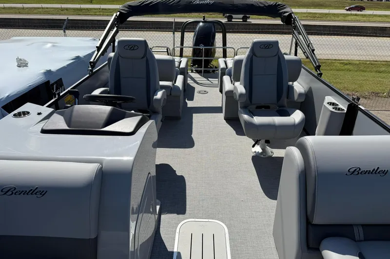 Slide: The Image of 2025 Bentley Pontoons Legacy 243 QSB interior with luxurious seating and modern design. - 4