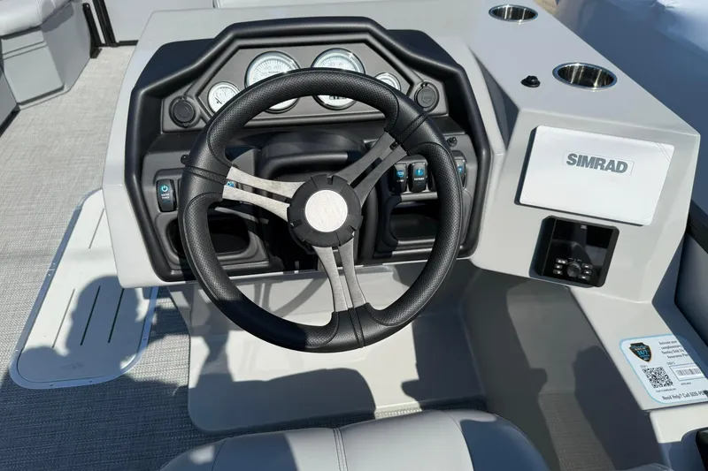 Slide: The Image of Steering console of 2025 Bentley Pontoons Legacy 243 QSB with Simrad display. - 6