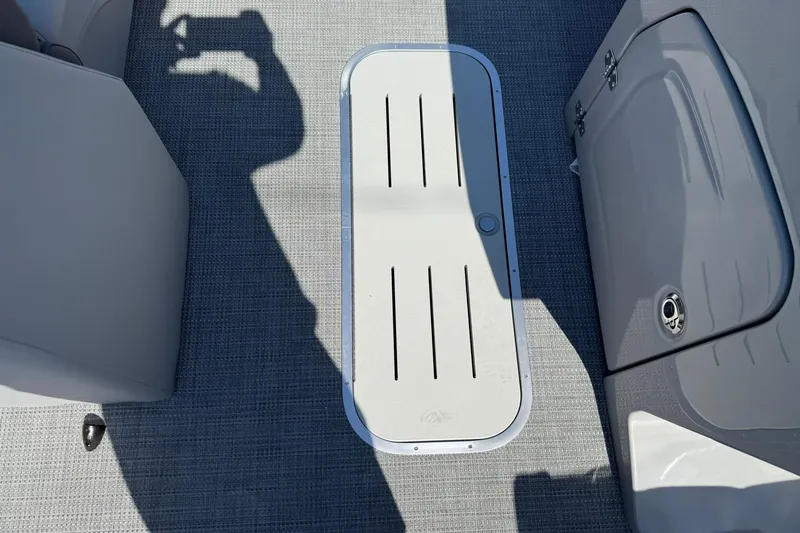 Slide: The Image of 2025 Bentley Pontoons Legacy 243 QSB interior flooring and storage compartment. - 9