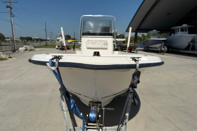 Slide: The Image of 2004 Sea Hunt Triton 186 boat on trailer in marina setting. - 3