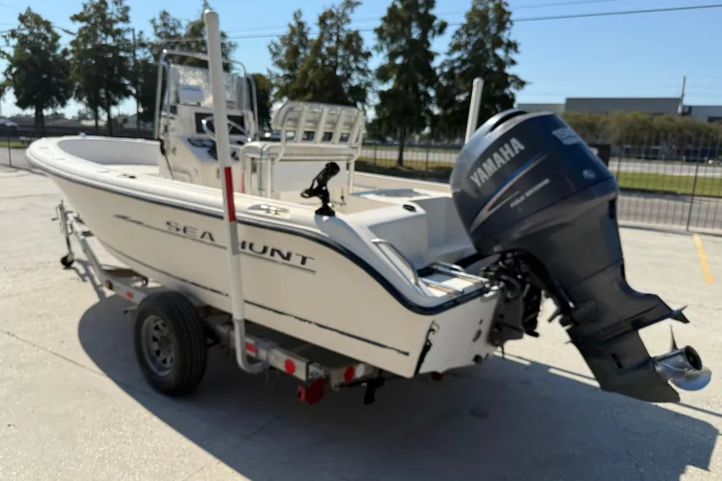 Slide: The Image of 2004 Sea Hunt Triton 186 boat with Yamaha outboard motor on trailer. - 5