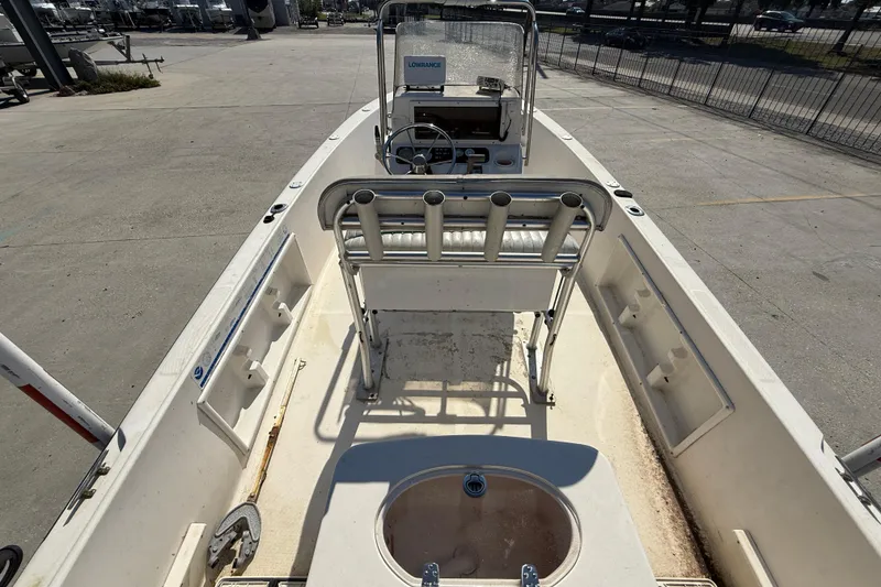 Slide: The Image of 2004 Sea Hunt Triton 186 boat interior with steering console and rod holders. - 8