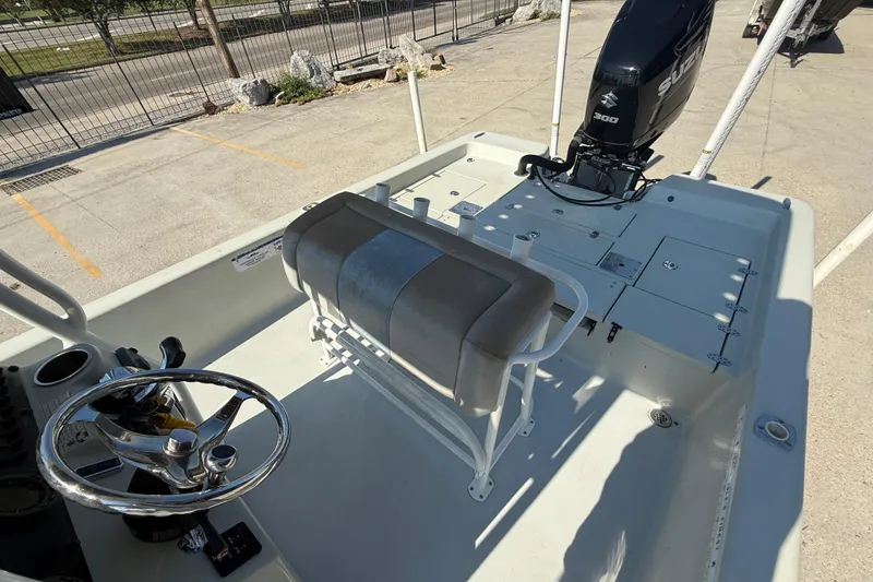 Slide: The Image of 2016 Blazer Bay 2420 Professional boat interior with steering wheel and Suzuki engine. - 11