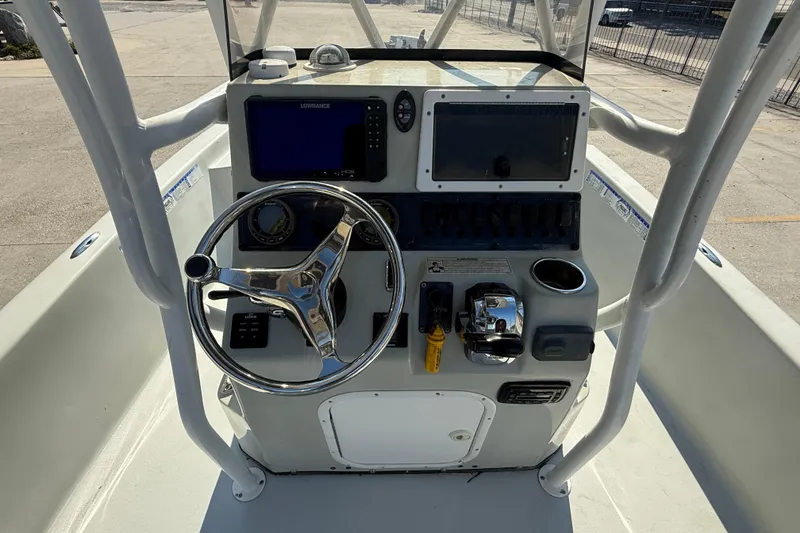 Slide: The Image of 2016 Blazer Bay 2420 Professional boat console with steering wheel and navigation equipment. - 12