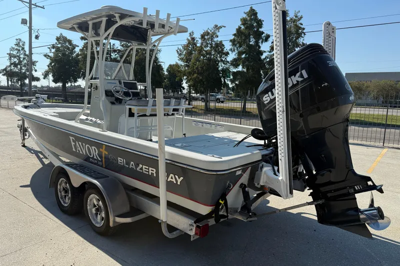 Slide: The Image of 2016 Blazer Bay 2420 Professional boat with Suzuki outboard motor on trailer. - 5
