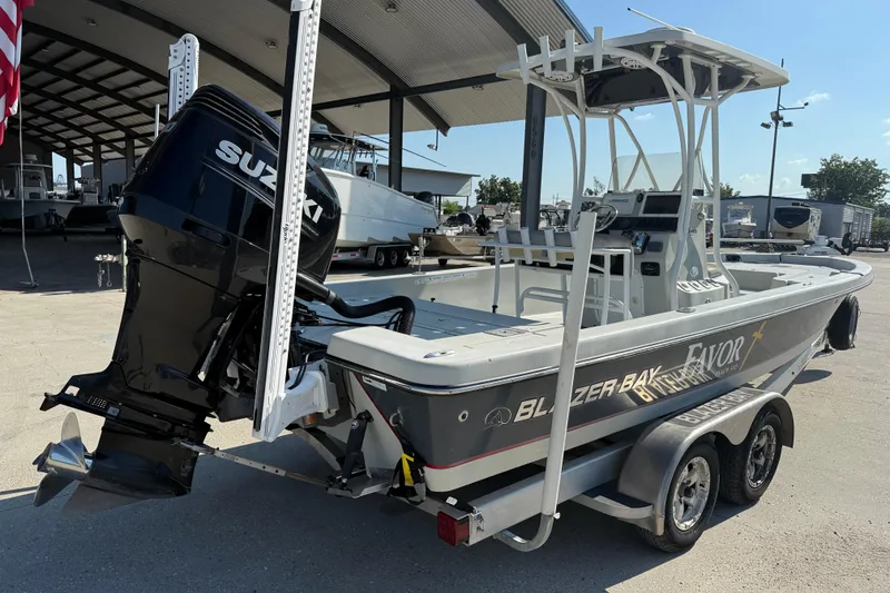 Slide: The Image of 2016 Blazer Bay 2420 Professional boat with Suzuki outboard motor on trailer. - 7