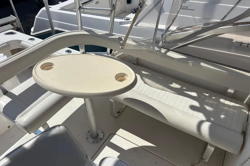 Slide: The Image of Interior of 2000 Shamrock 260 Express boat with seating and oval table. - 36