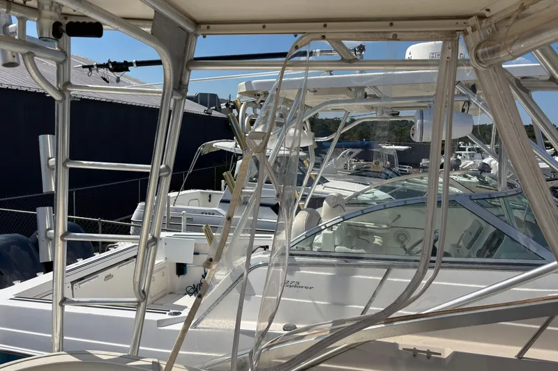 Slide: The Image of 2000 Shamrock 260 Express boat docked, featuring sleek design and modern equipment. - 37