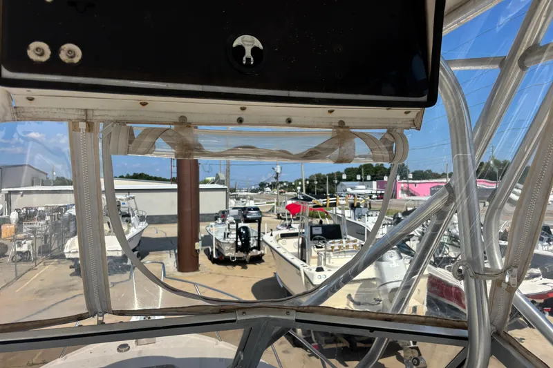 Slide: The Image of View from a 2000 Shamrock 260 Express boat, overlooking a marina with multiple boats. - 40