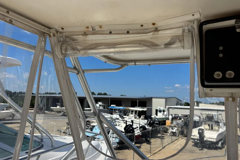 Slide: The Image of View from a 2000 Shamrock 260 Express boat, overlooking a marina with multiple boats. - 41