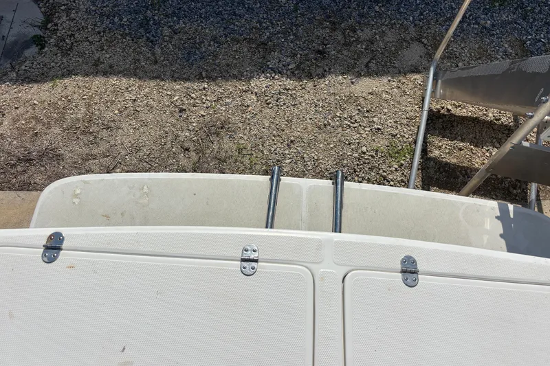 Slide: The Image of Rear view of 2000 Shamrock 260 Express boat with swim platform and ladder. - 58