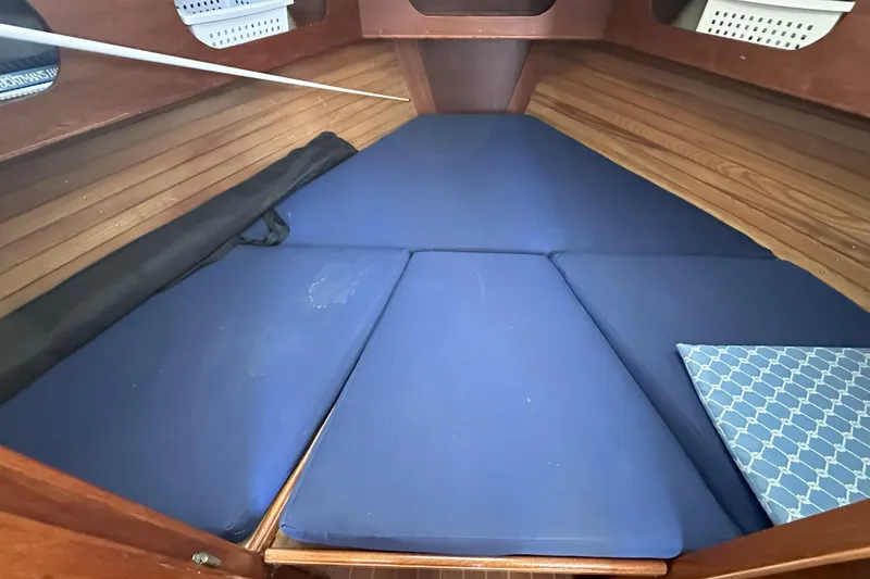 Slide: The Image of Interior cabin of 1986 Cape Dory 28 Flybridge with blue cushions. - 6