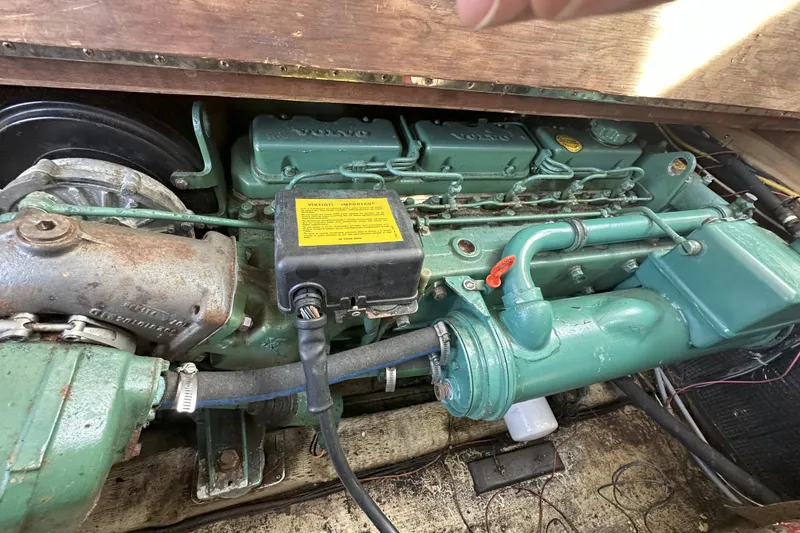 Slide: The Image of Engine of 1986 Cape Dory 28 Flybridge boat, featuring Volvo components. - 9