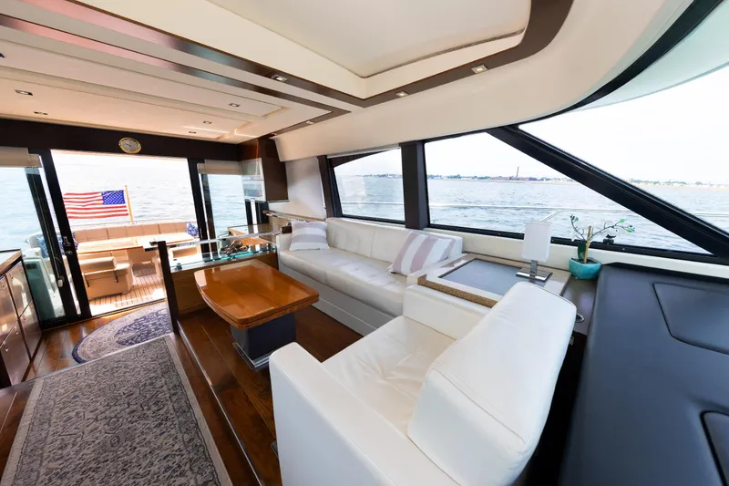 Slide: The Image of Luxurious interior of 2014 Tiara 5000 Coupe yacht with ocean view and American flag. - 21