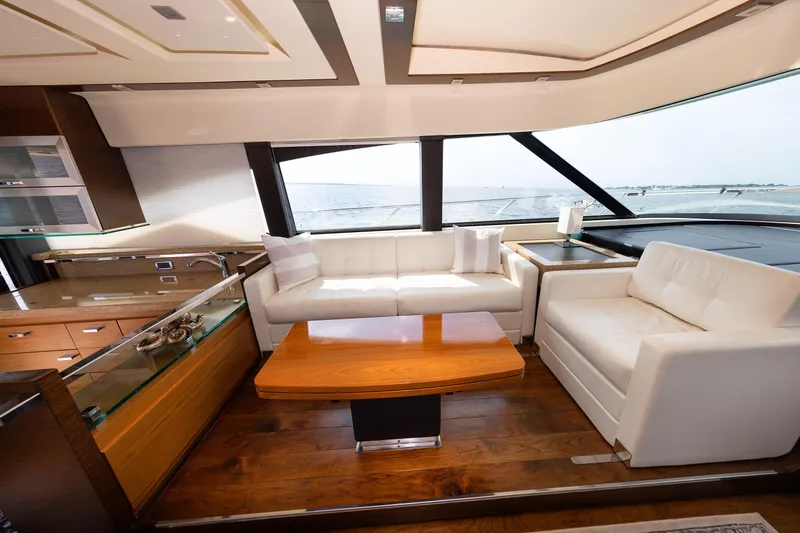 Slide: The Image of Luxurious interior of 2014 Tiara 5000 Coupe yacht with elegant seating and panoramic windows. - 22