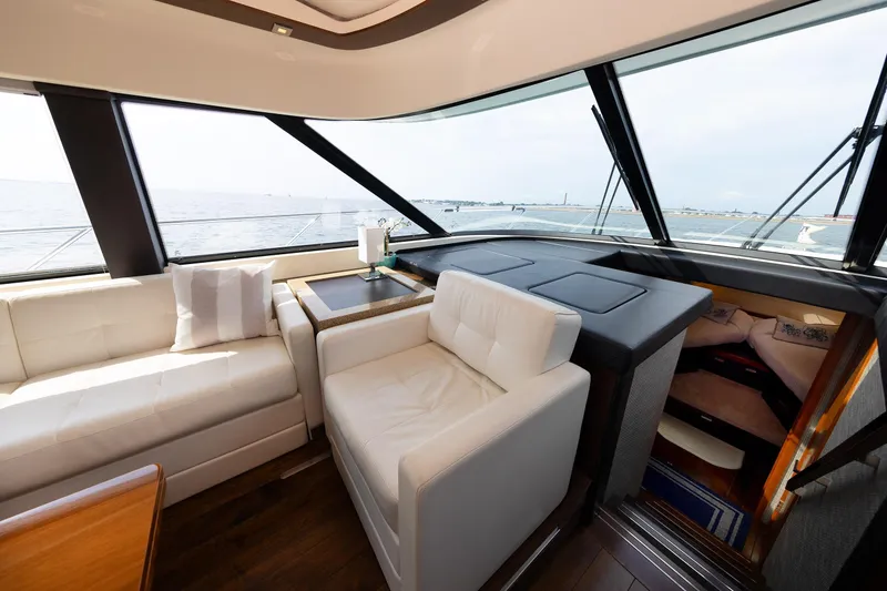 Slide: The Image of Luxurious interior of a 2014 Tiara 5000 Coupe yacht with ocean view. - 24