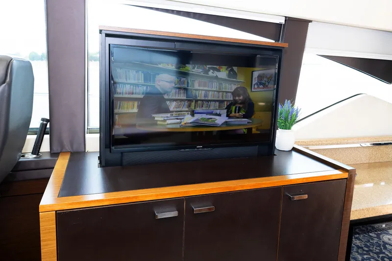 Slide: The Image of Interior of 2014 Tiara 5000 Coupe with TV and potted plant on cabinet. - 29