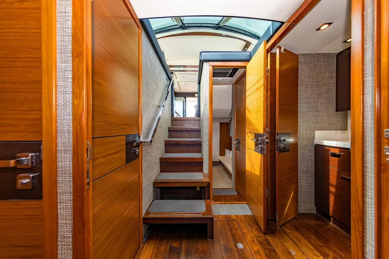 Slide: The Image of Luxurious interior of 2014 Tiara 5000 Coupe yacht with wooden finishes and modern design. - 30