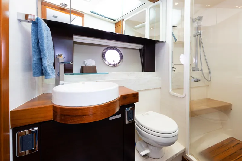 Slide: The Image of Luxurious bathroom in 2014 Tiara 5000 Coupe yacht with modern fixtures and shower. - 33