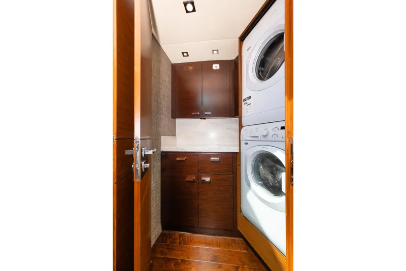 Slide: The Image of Compact laundry area in 2014 Tiara 5000 Coupe with stacked washer and dryer. - 34
