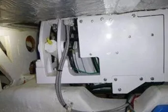 Slide: The Image of Engine compartment of a 2014 Tiara 5000 Coupe, showcasing mechanical components and wiring. - 41