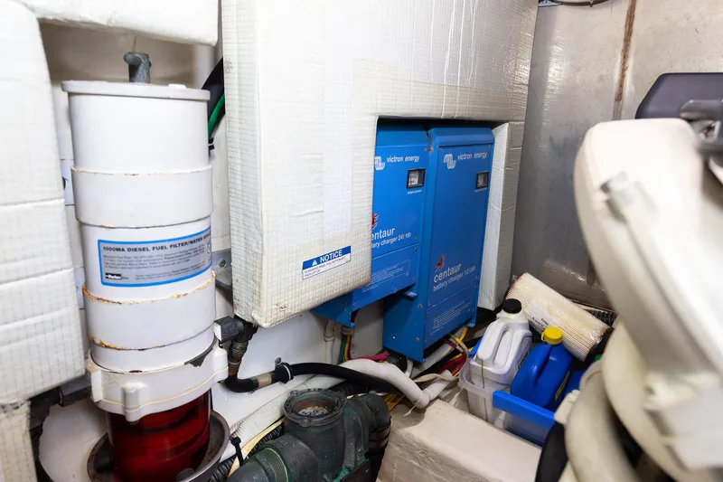 Slide: The Image of Engine room of 2014 Tiara 5000 Coupe with battery chargers and diesel filter. - 43