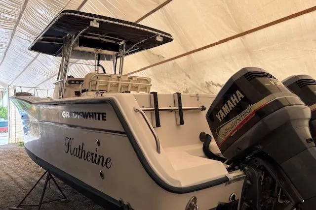 Slide: The Image of 2000 Grady-White Bimini 306 boat with Yamaha engines in covered storage. - 2