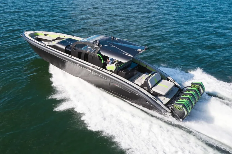 The Image of Midnight Express 52' Vitesse luxury speedboat cruising on open water. - 0