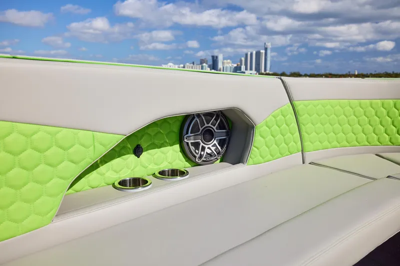 Slide: The Image of Luxurious interior of Midnight Express 52' Vitesse boat with green quilted upholstery and speaker. - 11